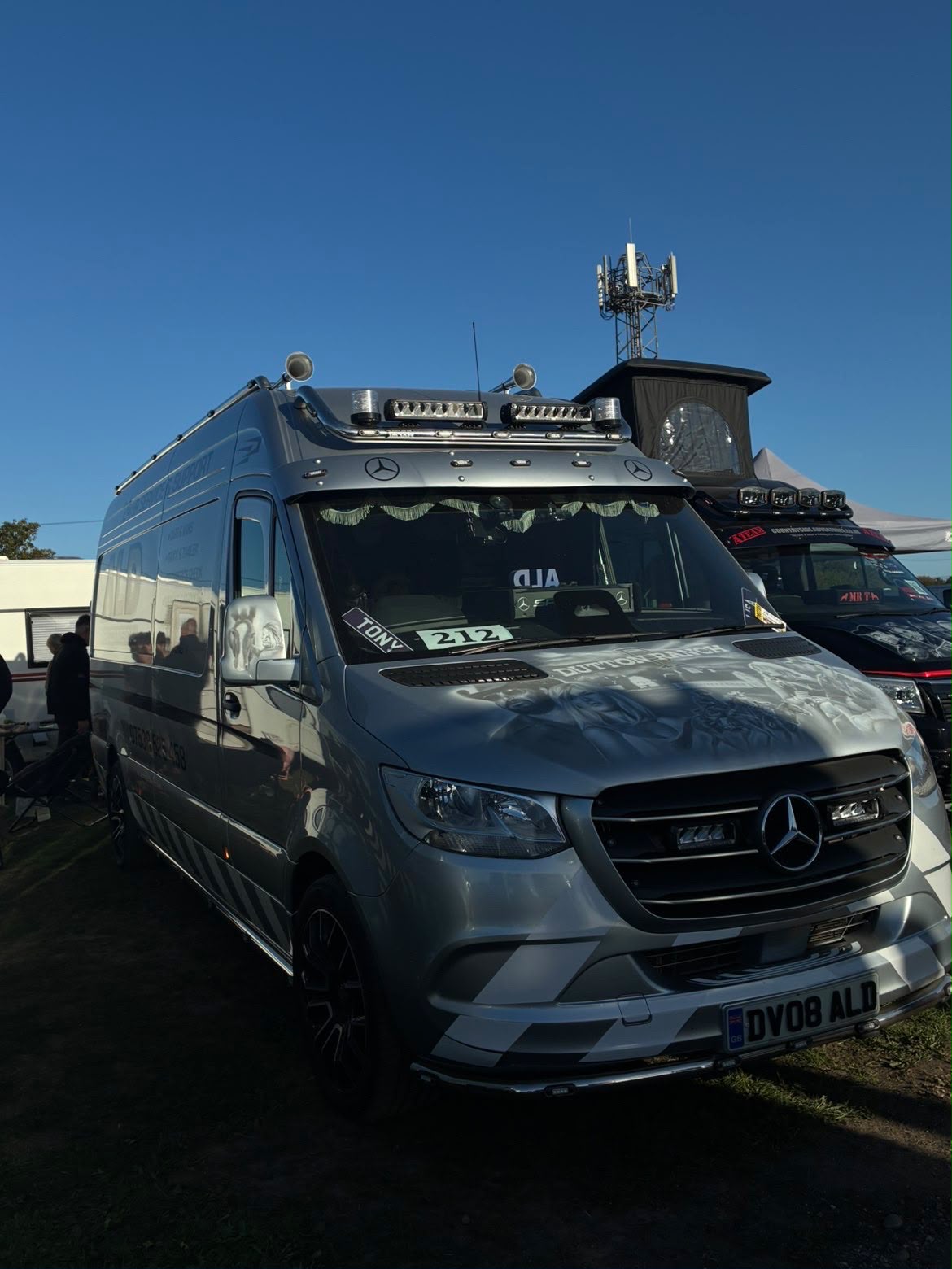 An ALD Mercedes Sprinter service van parked up at a rally field