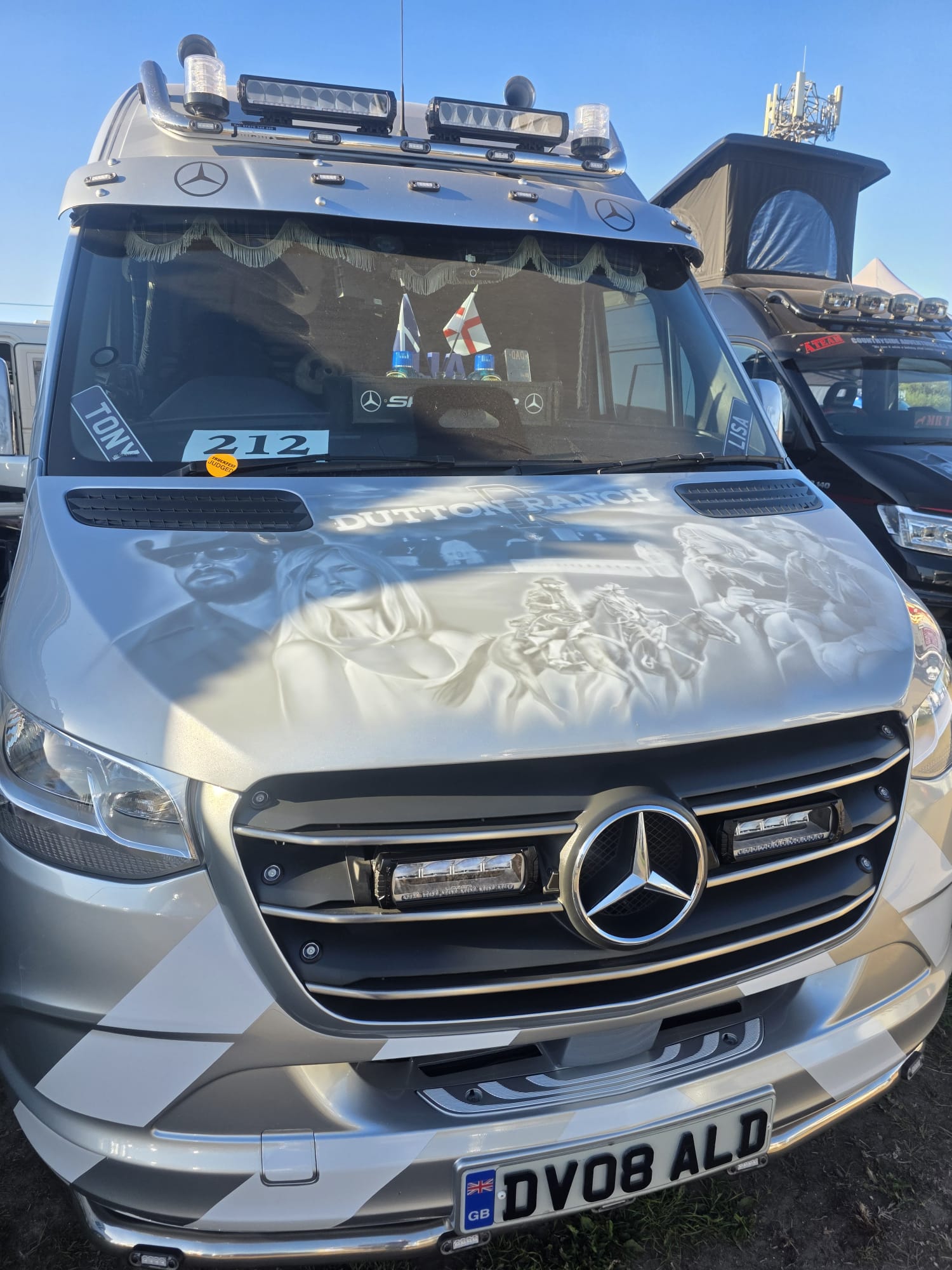 Close-up of an ALD Mercedes Sprinter service van's front grille and light bar