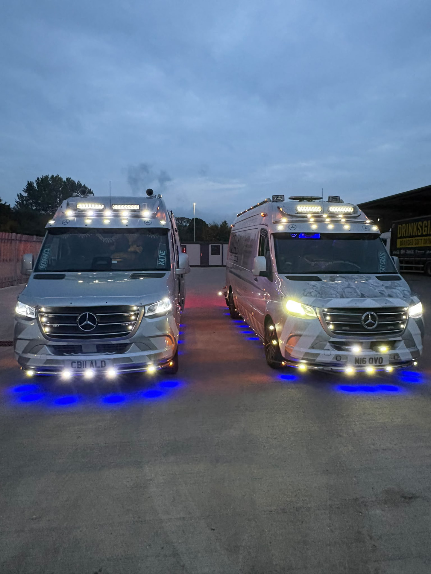 Two ALD Mercedes Sprinter vans with lights on at dusk, ready for a callout